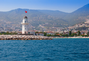 Wall Mural - lighthouse in alanya, antalya district, turkey, asia. view on city from boat. popular tourist destin