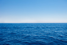 Background Of Sparkling Sea Water On A Bright Sunny Day. Sea And Sky