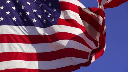 Wall Mural - us flag unfurling in the breeze. shot with a high-speed camera.