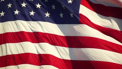 Wall Mural - us flag unfurling in the breeze. shot with a high-speed camera.
