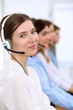 © rogerphoto - Call center operator.Young beautiful business woman in headset.