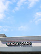 Payday Loans on a blue sky.