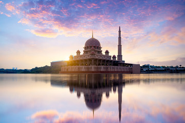 putra mosque during sunrise with reflection, malaysia
