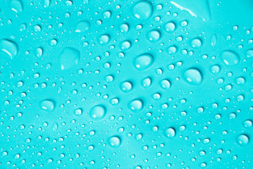 Wall Mural - water drop on blue background