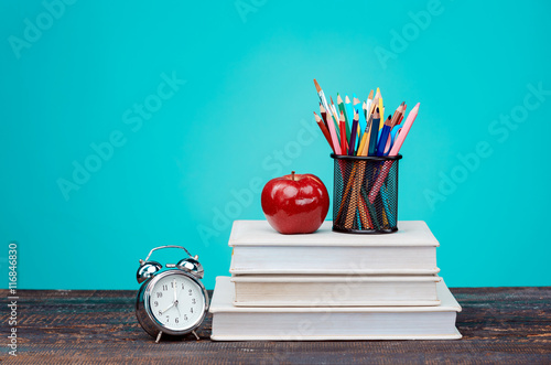 Stampa su Tela Back to School concept. Books, colored pencils and clock