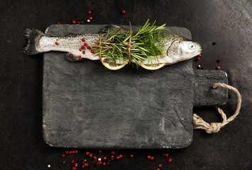 Wall Mural - Raw rainbow trout with lemon, herbs and spice