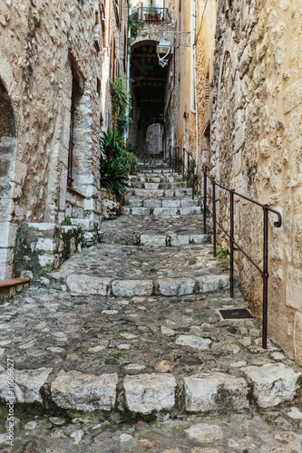 Naklejka dekoracyjna Narrow cobbled street in the old village France.