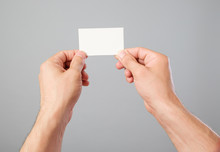 Man's Hand Holding Blank Business Card