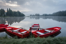 Red Boats On Pond