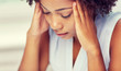 © Syda Productions - close up of african young woman touching her head