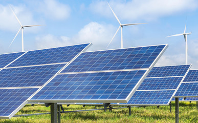 Wall Mural - photovoltaics module solar panel and wind turbines generating electricity renewable green energy