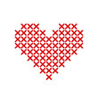 Hand-made red heart embroidered with a cross