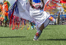 Close Up Of Legs Kicking It At Powwow.