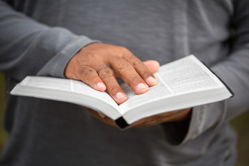 Man reading a Bible.