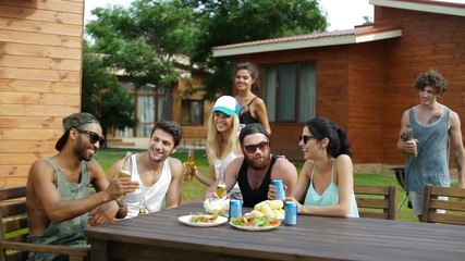 Sticker - Group of young beautiful happy people having drinks and snacks at the picnic area