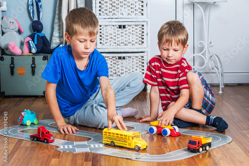 boys playing with cars
