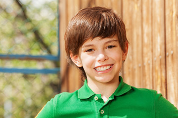 Close-up portrait of smiling dark-haired boy