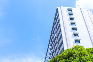 Wall Mural - Apartment building in Japan, against blue sky