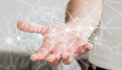Fototapete - Businessman using data network with his hand