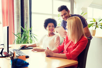 Poster - happy creative team with computer in office