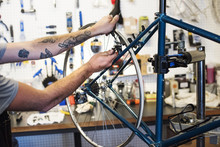 Man working in bicycle repair shop