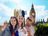 Fototapeta Londyn - group of smiling women taking selfie in london