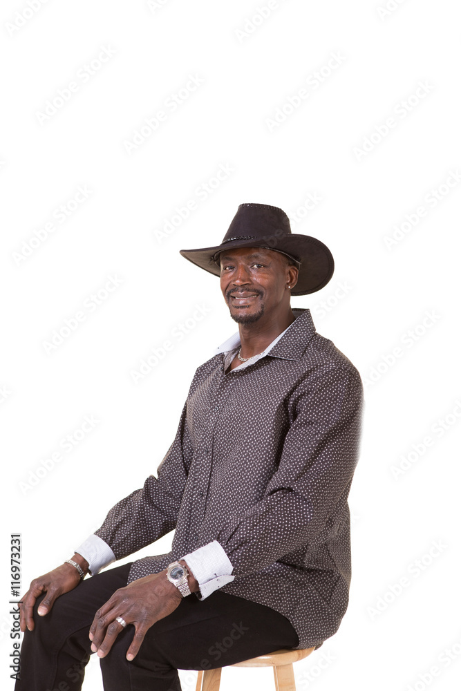 Black man in cowboy hat shop