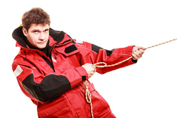 Young man pulling rope.