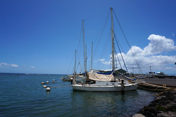 Boats sit in the water at at Kaunakakai Ferry Terminal