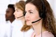© rogerphoto - Call center operator.Young beautiful business woman in headset.