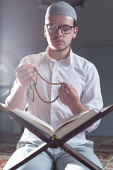 Wall Mural - Muslim Man Is Praying In The Mosque