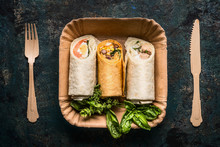 Vegetarian Tortilla Wraps In Paper Plate And Wooden Cutlery On Dark Background, Top View, Close Up. Healthy Lunch Snack Or Street Food Concept