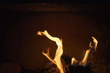 close up of charcoal burning in fireplace