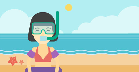 Poster - Woman with snorkeling equipment on the beach.