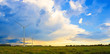 © sebos - Panorama of two windmills on rural field in the sunset. Wind turbines panorama in countryside.