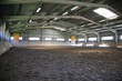 Riding hall with sandy covering without people