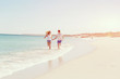 © Sergey Nivens - Romantic young couple on the beach