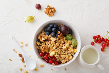 Wall Mural - healthy granola in white bowl and summer berries