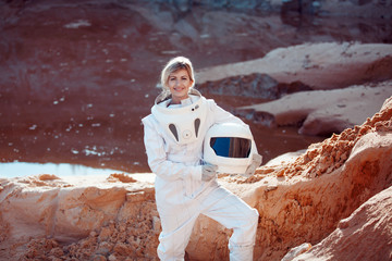Wall Mural - futuristic astronaut without a helmet on another planet, image with the effect of toning