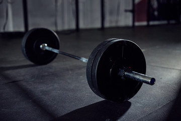 Closeup of barbell on gym floor