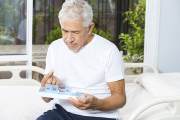 Poster - Patient Removing Pill From Container In Rehab Center