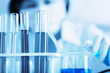 © jayzynism - Female medical or scientific researcher using test tube on labor