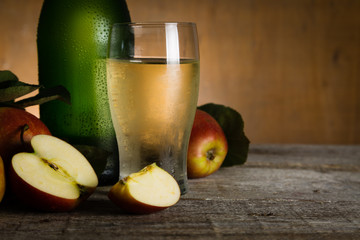 apple cider in glass bottle with water drops