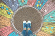 Comfort zone concept. Feet standing inside comfort zone circle.