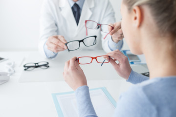 Woman choosing her new glasses