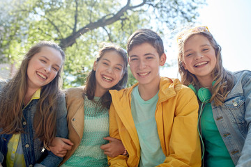 Canvas Print - happy teenage students or friends outdoors