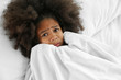 © Africa Studio - Cute African girl in bed