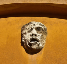 Grotesque Face Or Mask On A Wall In Venice