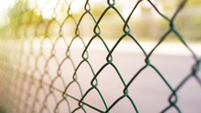 Wire Fence With Futsal Field On Background