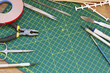 © katildam - Plastic model kit and tools, hobby workplace background top view.
